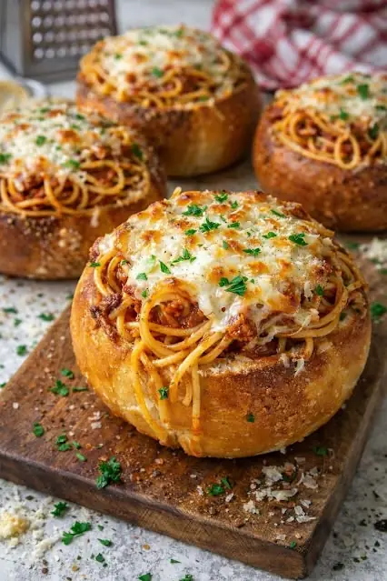 Cheesy Spaghetti Stuffed Bread Bowls