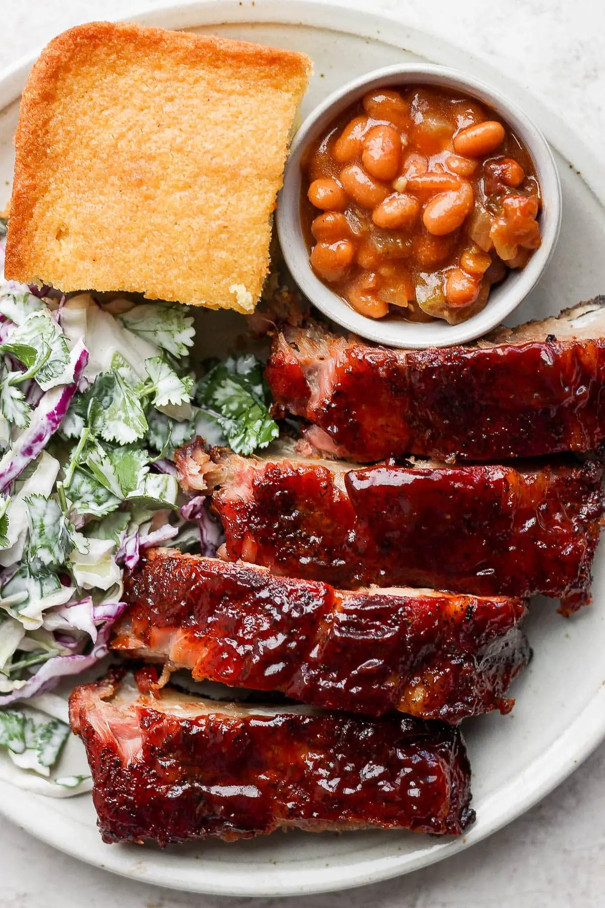 Dry Rubbed Smoked Baby Back Ribs – Shattered-Char Bark with a High-Gloss Ebony Mirror